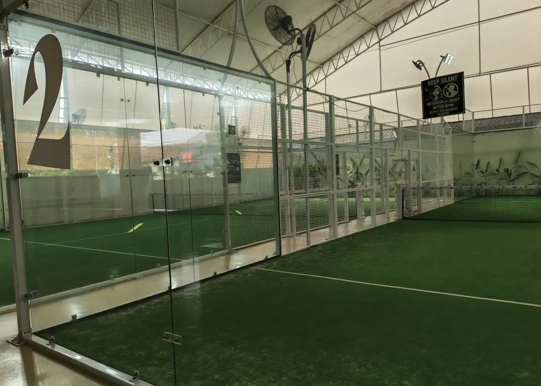 Court 2 behind glass with fans along the side