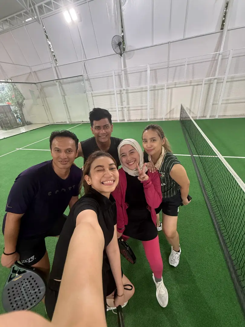 Friends taking a selfie on court