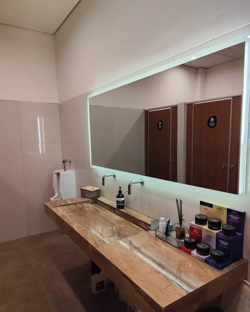 Restroom with lit mirror